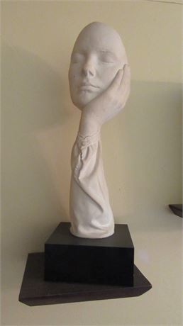 Human Face in Hand Sculpture
